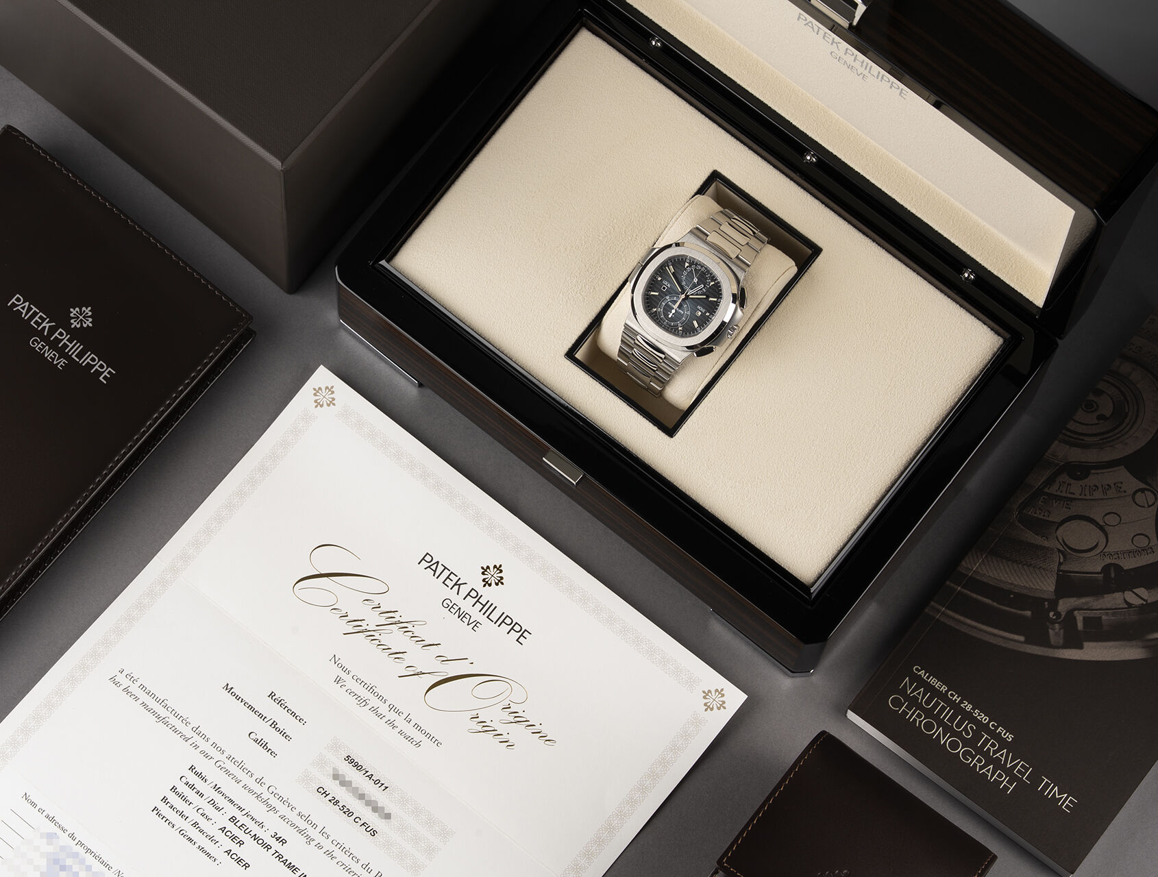 ref 5990/1A-011 | 5990/1A - Box & Certificate | Patek Philippe Nautilus Travel Time Chronograph