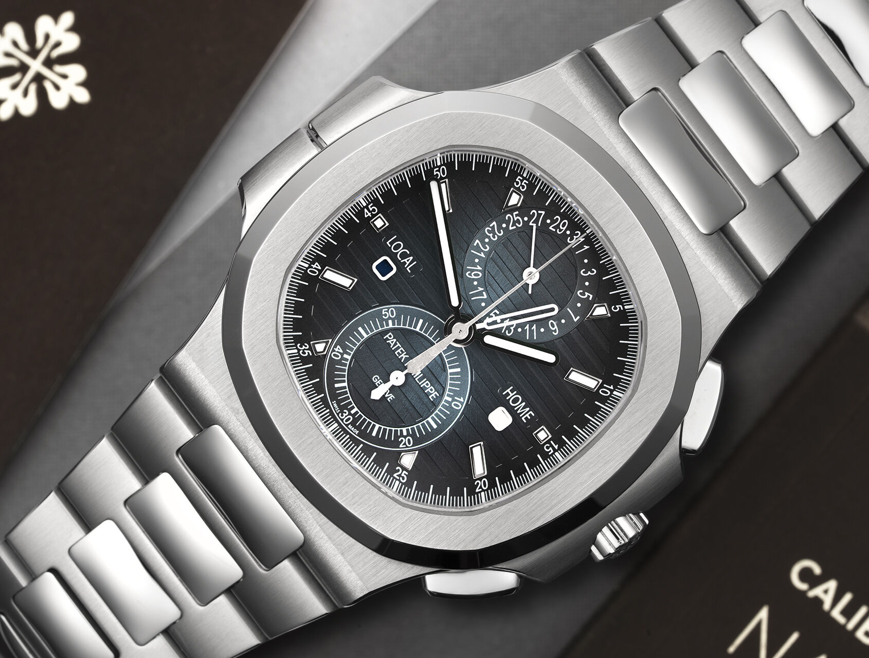 ref 5990/1A-011 | 5990/1A - Box & Certificate | Patek Philippe Nautilus Travel Time Chronograph